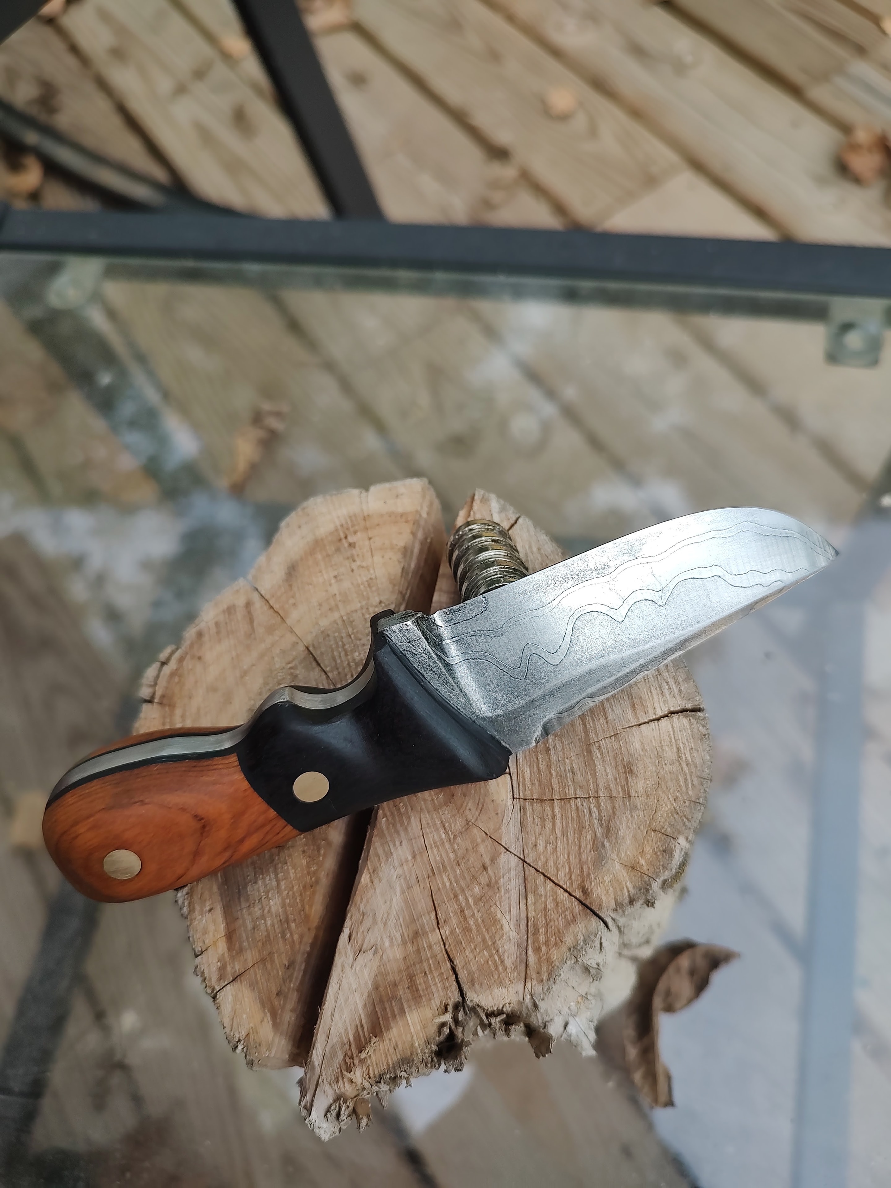 Carving knife on wood shavings workbench