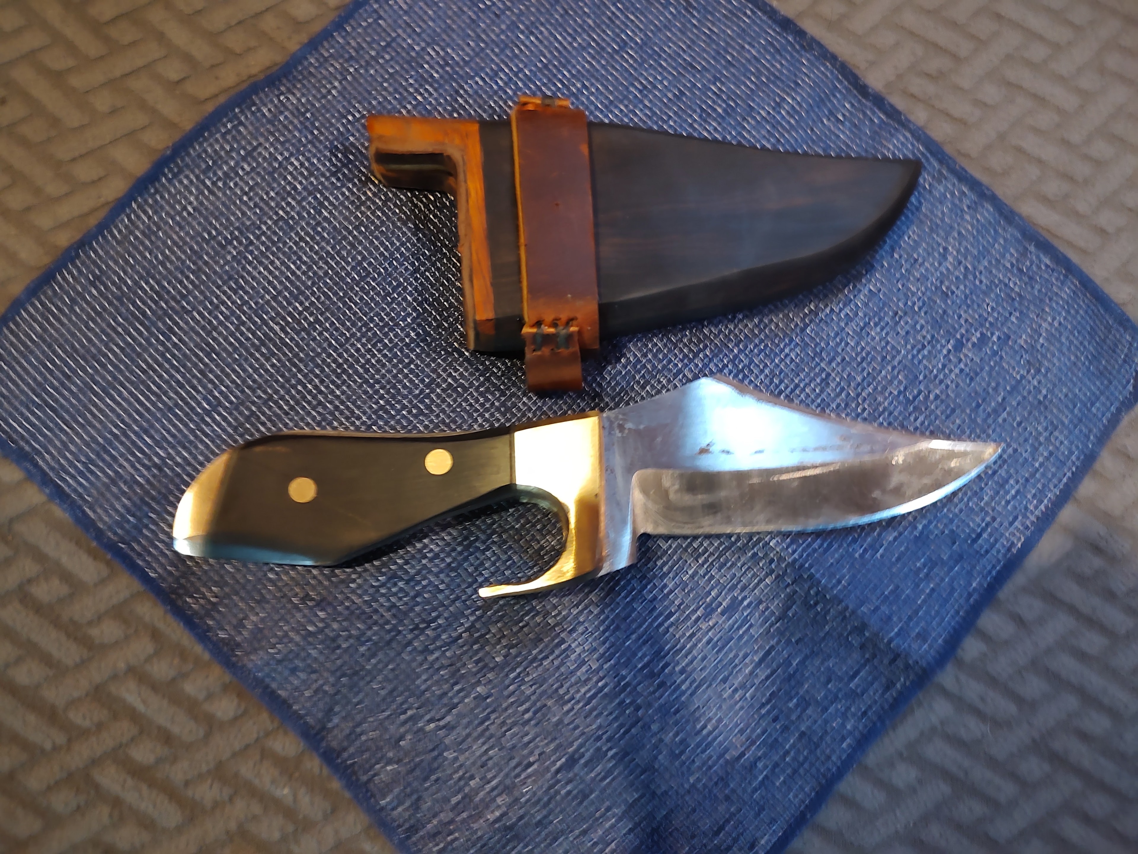 Hunting knives with leather sheaths