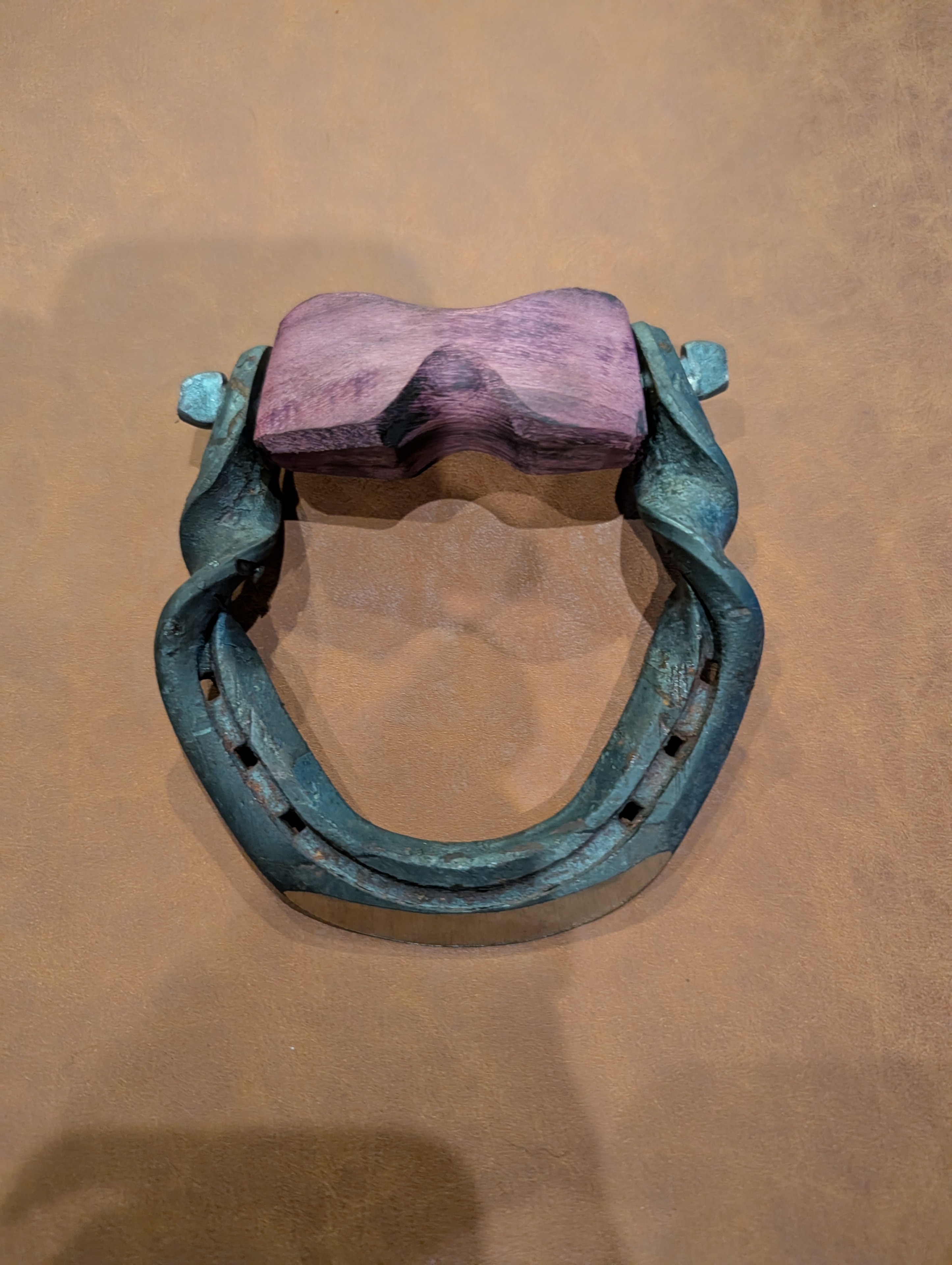 Sculptural horseshoe piece with purple stabilized wood accent