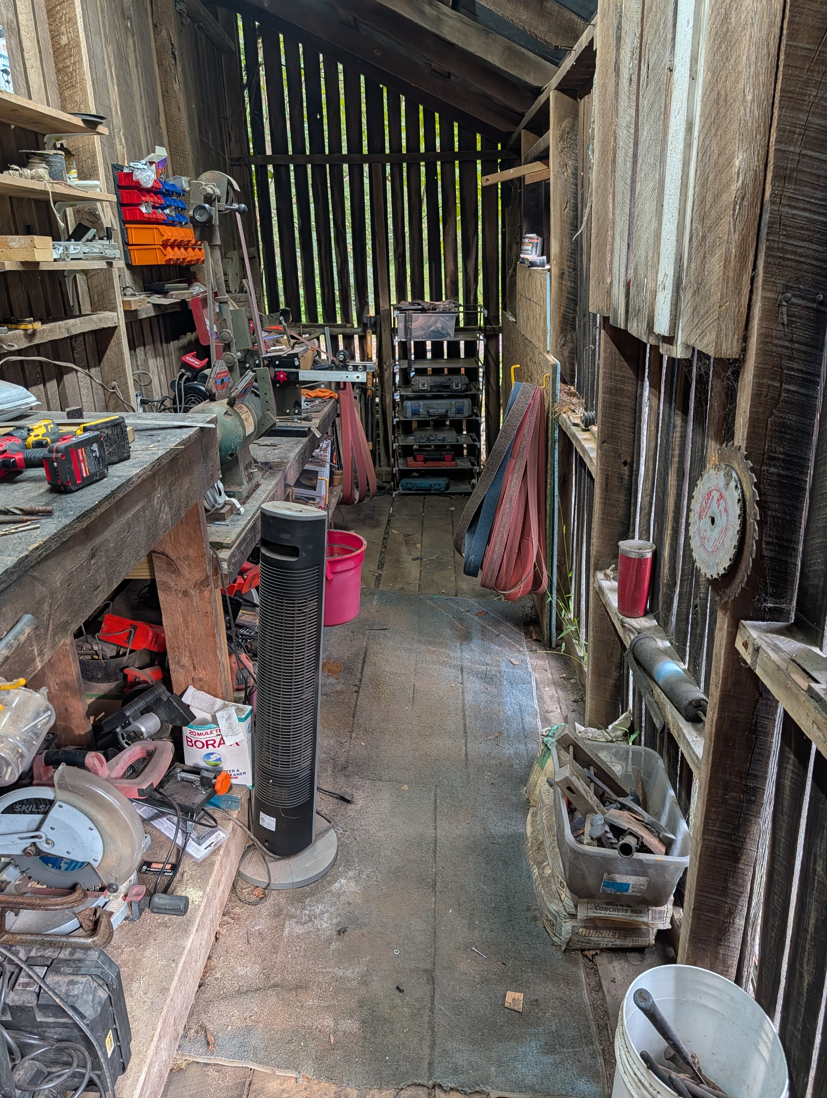 Bsharp Blacksmith workshop — aisle view with grinder and belt sander