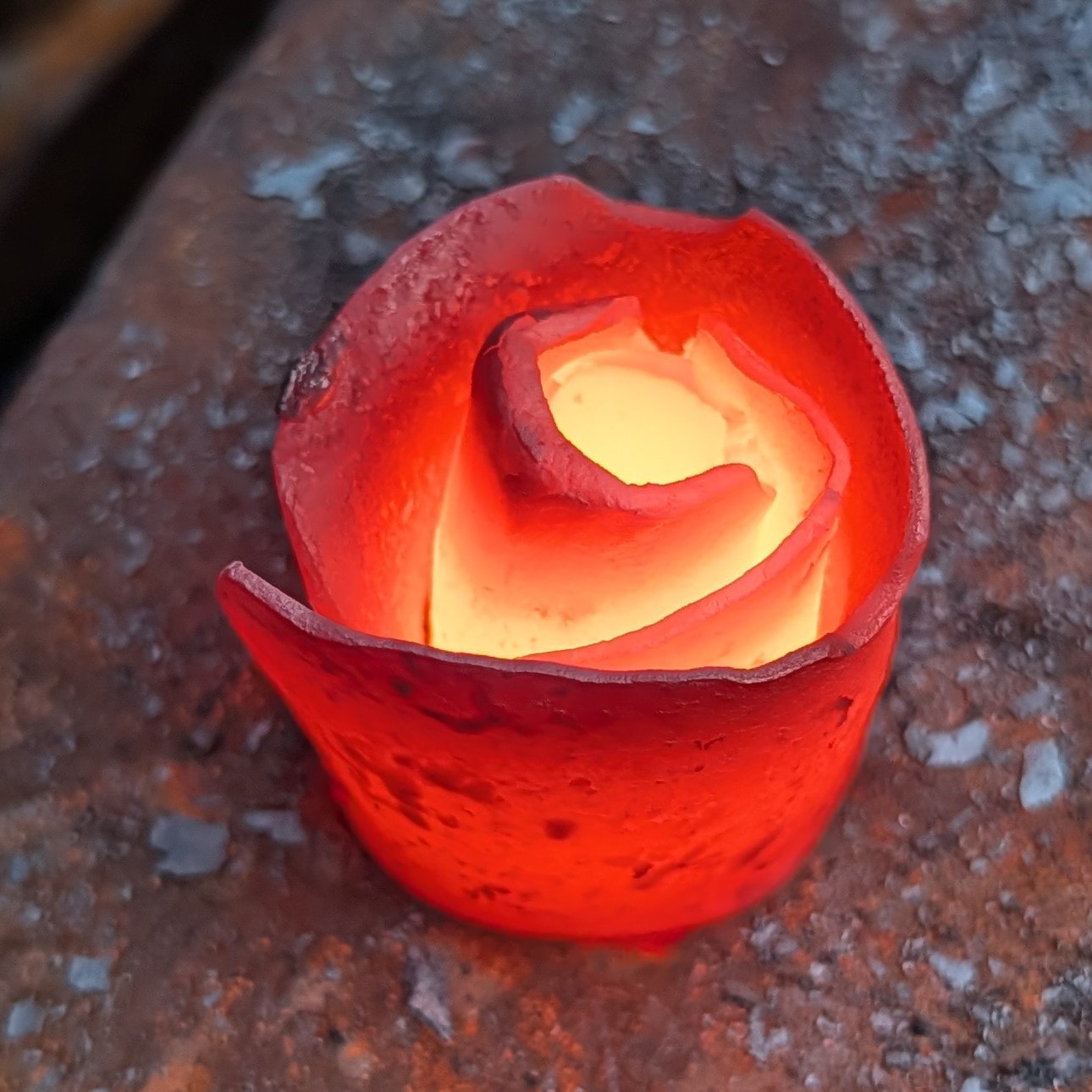 Forged metal rose on the anvil